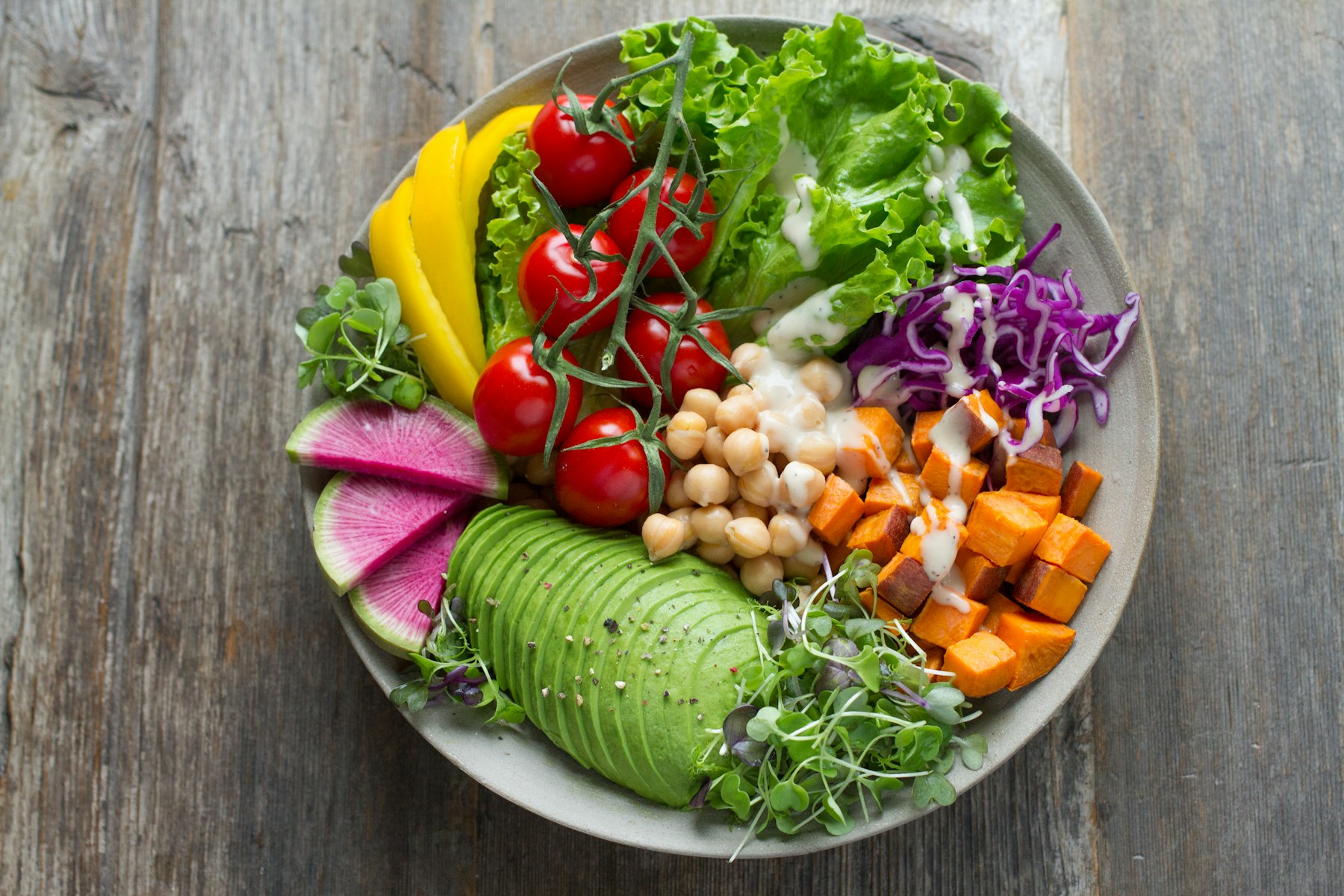 A colourful bowl of vegetables and grains